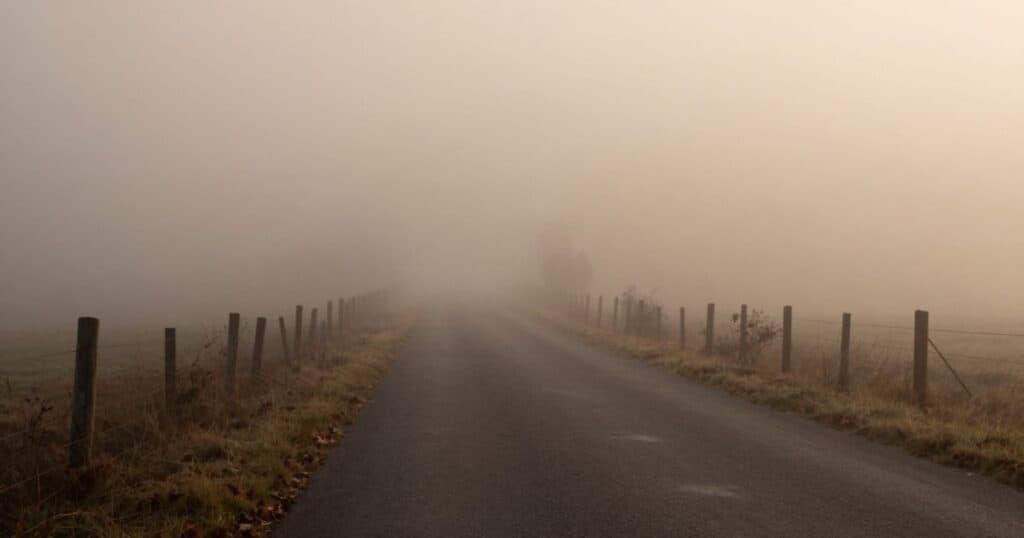 Foggy road stretching into the distance, with the way ahead obscured by mist, used is what is a prologue article.